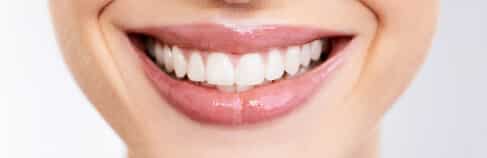Home 5 Girl With Lip Gloss And Straight Teeth Smiling