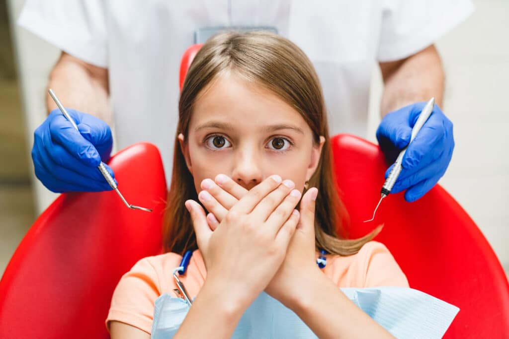 young girl with dental anxiety