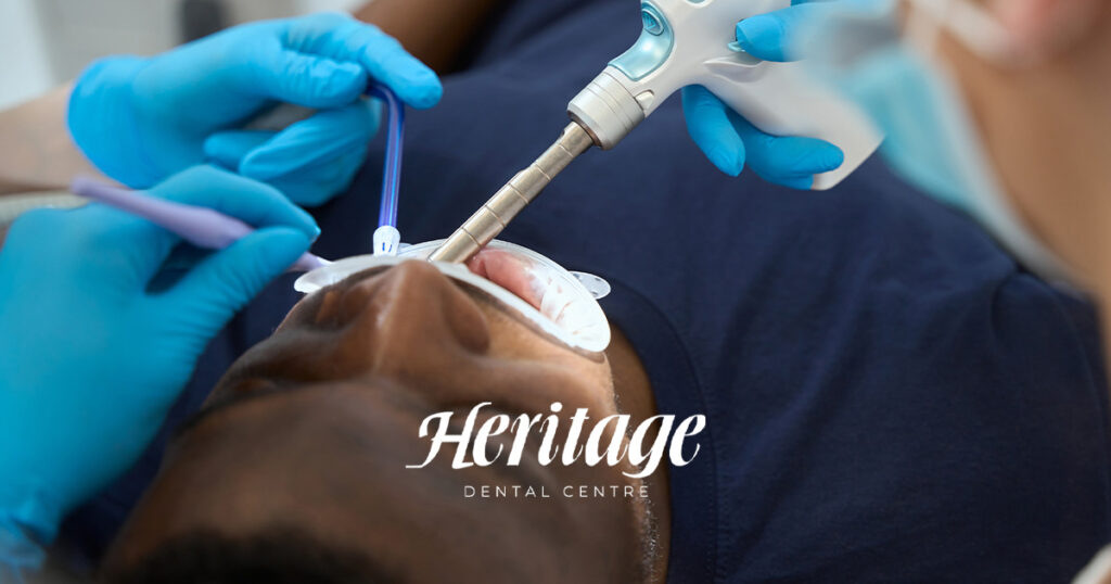 man getting his teeth cleaned at an edmonton dental clinic