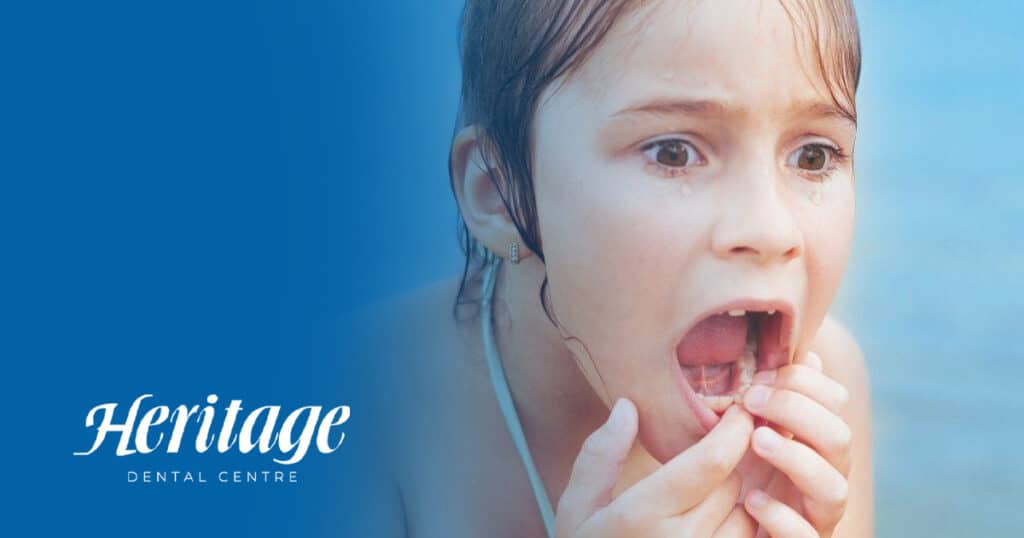 young girl worried that she chipped her tooth while swimming